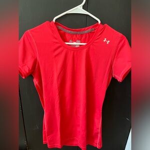 Pink under armour shirt.